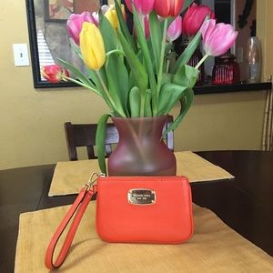 Micheal Kors peach Wristlet